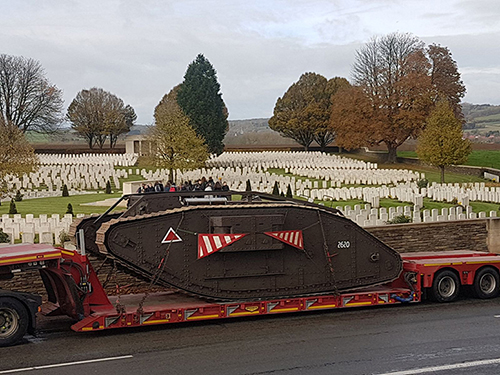 Tank driving past war graves